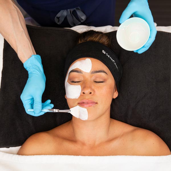 Client receiving facial treatment at SkinLab Honolulu